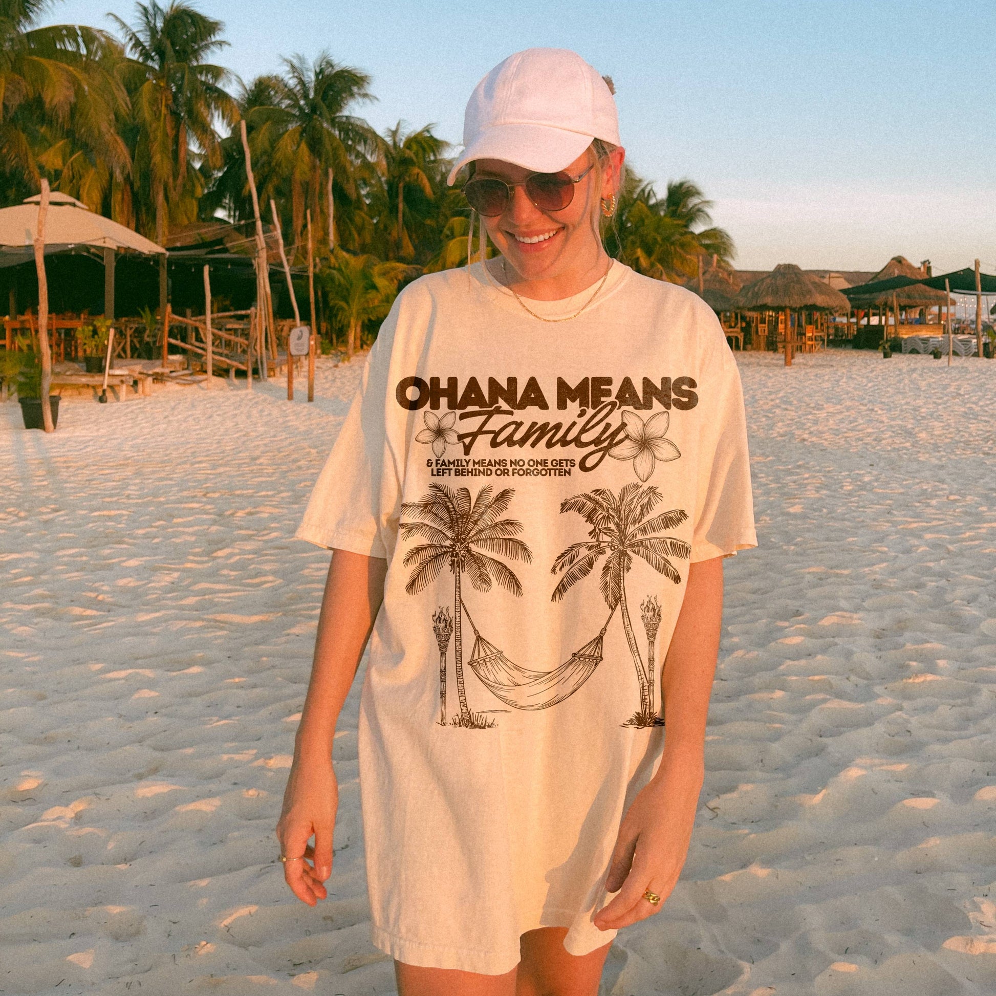 Person wearing a 'Ohana Means Family' t-shirt on a beach